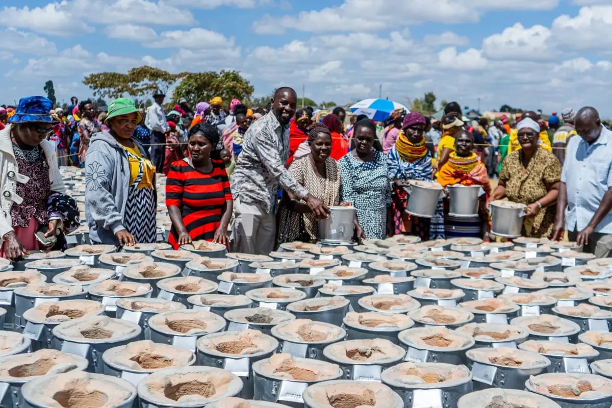 The Carbon Unit Market_ A 2025 Overview_DGB team members and local community during cookstove distribution_visual 4